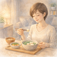 消化にやさしい夕食でリラックスしながら食事をする女性のイメージ