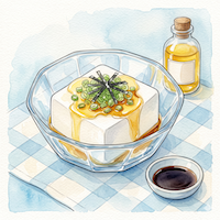 絹ごし豆腐にアマニ油と薬味をのせた、火を使わない冷やっこのアレンジレシピイメージ