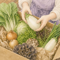 届いた野菜を眺めながら献立を考える手元を描いた水彩イラスト